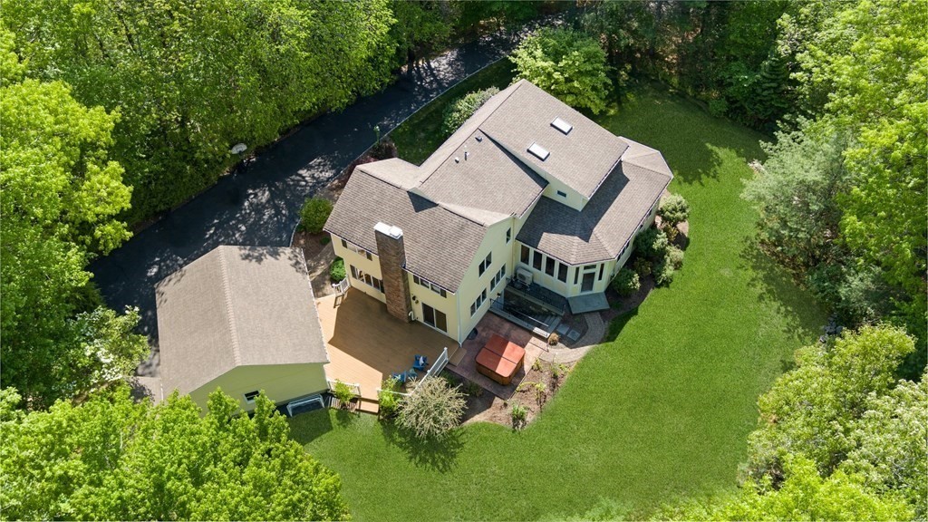 an aerial view of a house with outdoor space and street view