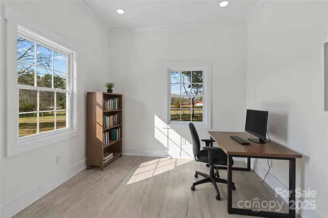 a workspace with furniture and a window