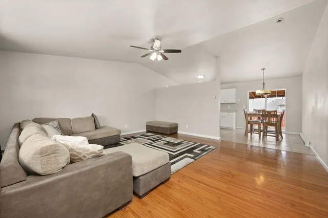 a bedroom with furniture and a wooden floor