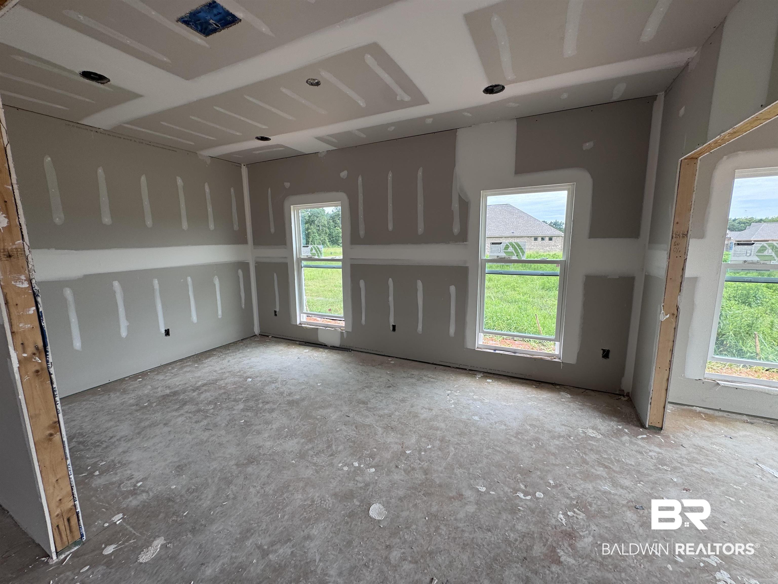 27355 Patch Pl Loop Daphne, AL 36526 - Photo 5 of 17 Unfinished interior room featuring multiple windows