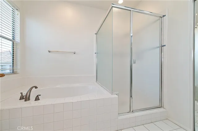 a bathroom with a tub and a sink