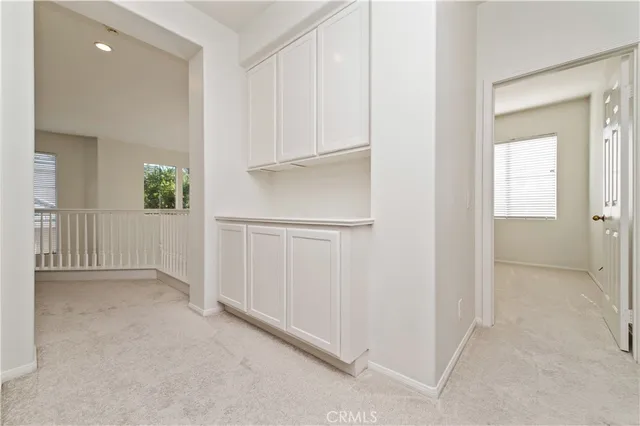 a view of empty room with windows