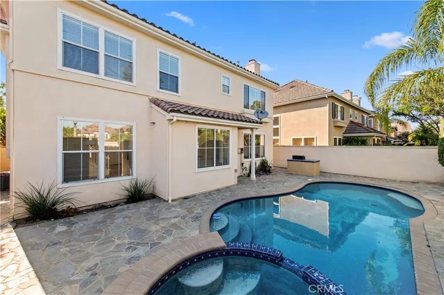 a view of a swimming pool with a yard