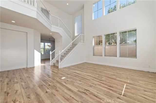 a view of an entryway with wooden floor