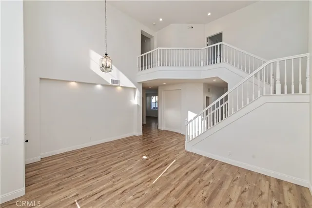 a view of an entryway with wooden floor