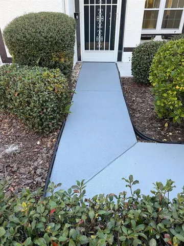 a kitchen with stainless steel appliances granite countertop a refrigerator and a stove