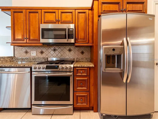 a view of room with window and a ceiling fan