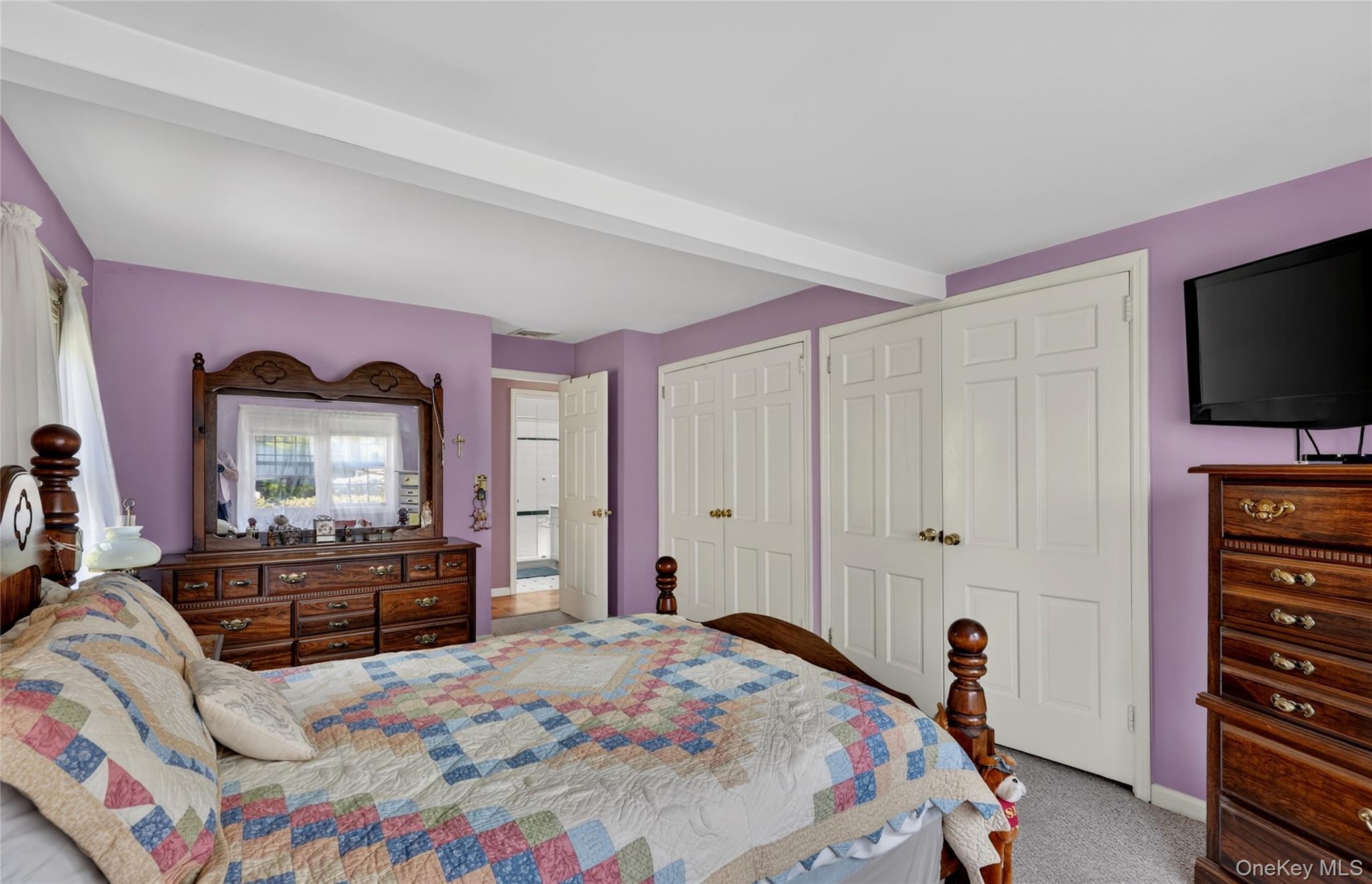 232 Cherry Road Yorktown Heights, NY 10598 - Photo 12 of 21 a bedroom with a bed and a flat screen tv