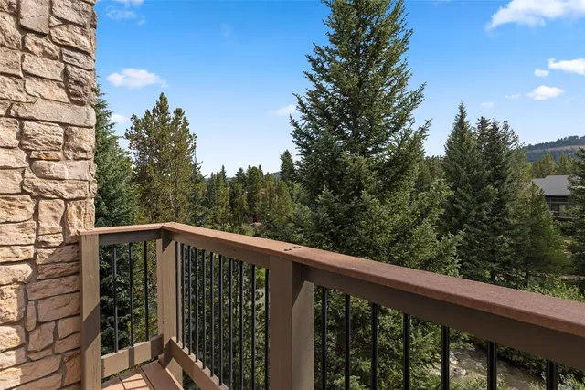 a view of balcony with deck and trees