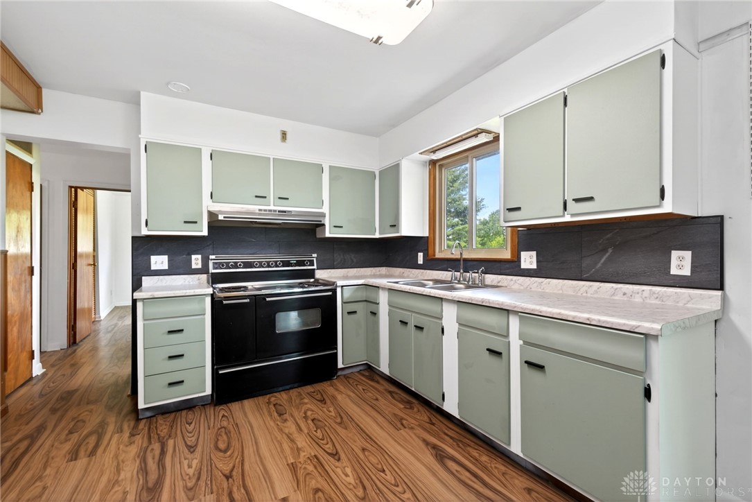 1005 Free Road New Carlisle, OH 45344 - Photo 15 of 43 This spacious kitchen offers ample cabinetry and an expansive countertop.