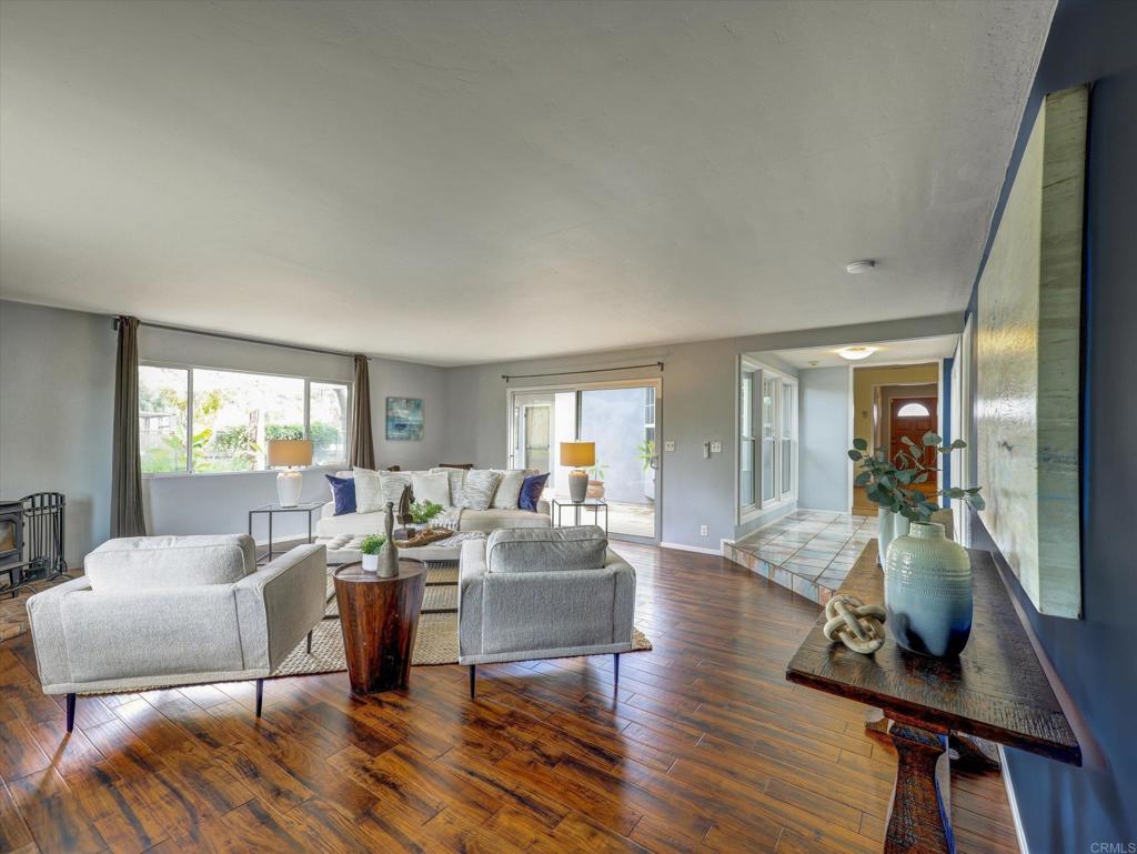 970 Quail Knoll Road Fallbrook, CA 92028 - Photo 14 of 45 a living room with furniture and a wooden floor
