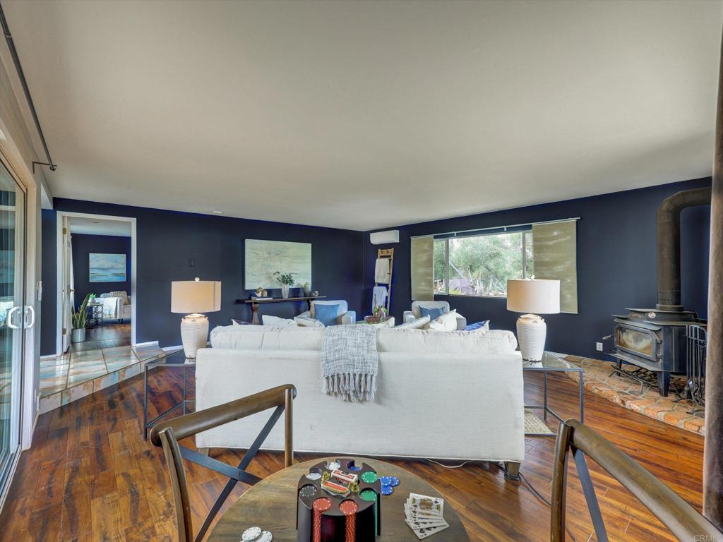 970 Quail Knoll Road Fallbrook, CA 92028 - Photo 15 of 45 a view of a dining room with furniture window and wooden floor