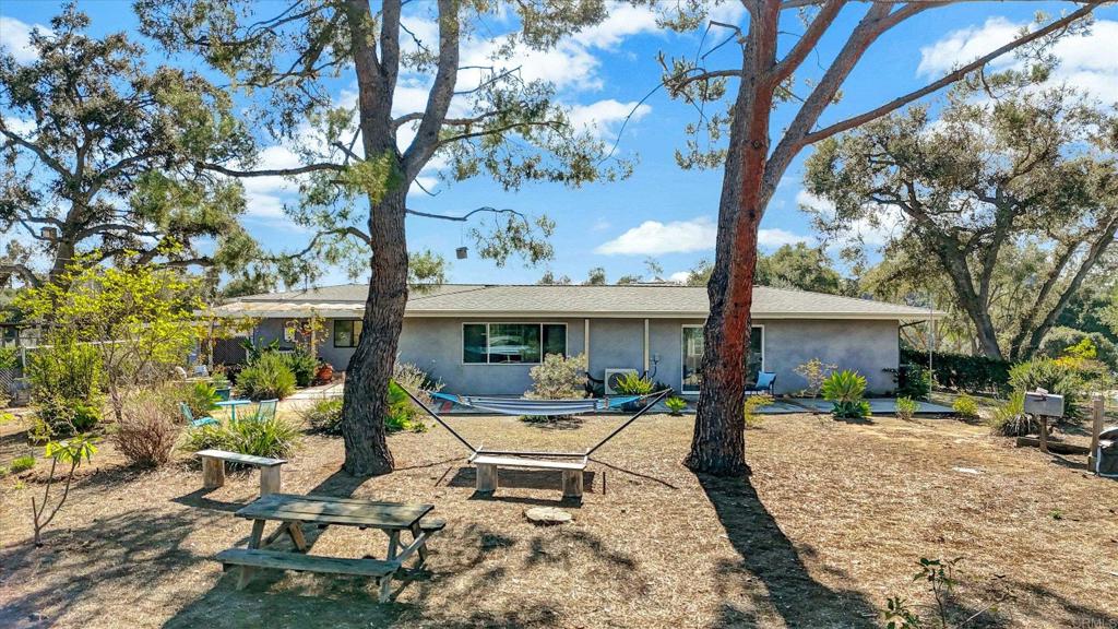 970 Quail Knoll Road Fallbrook, CA 92028 - Photo 41 of 45 a view of a house with backyard sitting area and porch
