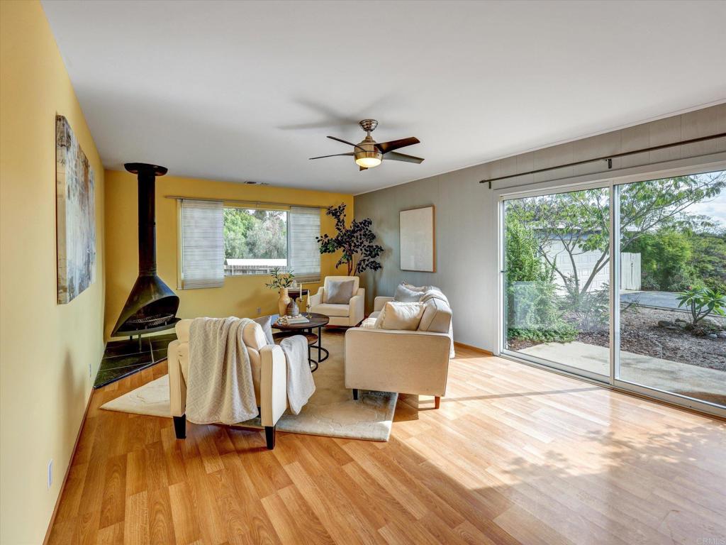 970 Quail Knoll Road Fallbrook, CA 92028 - Photo 8 of 45 a living room with furniture and a large window