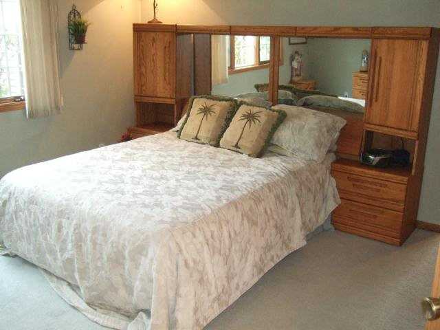 4691 South Farwell Bridge Road German Valley, IL 61039 - Photo 9 of 9 a large bed sitting in a bedroom next to a window