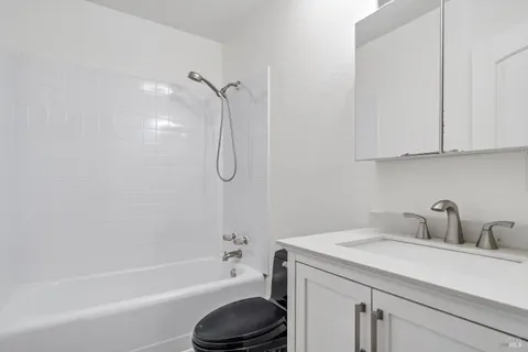 a bathroom with a sink a toilet and a bathtub