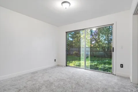 a view of room with window and floor to ceiling window