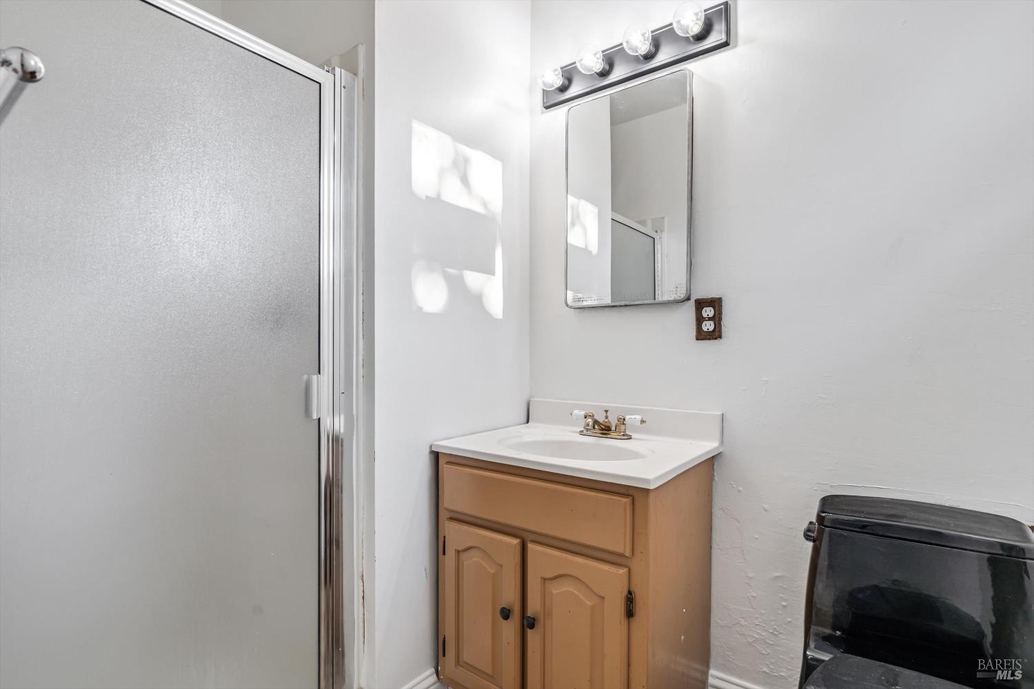 621 Sunny Manor Way Santa Rosa, CA 95401 - Photo 17 of 24 a bathroom with a sink vanity and a mirror