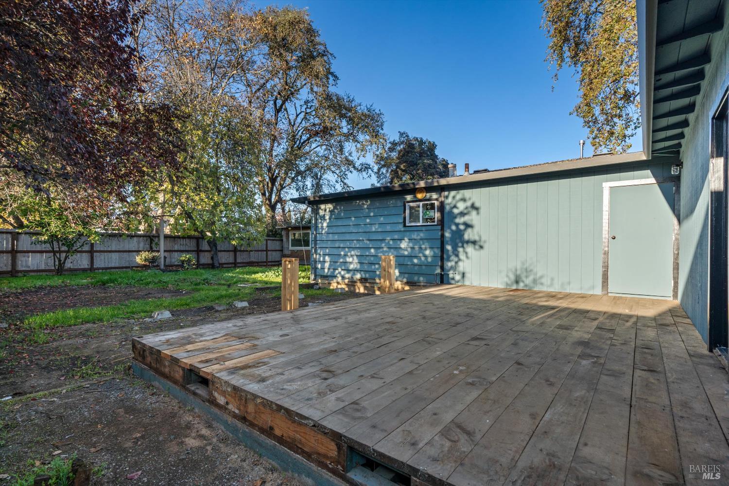 621 Sunny Manor Way Santa Rosa, CA 95401 - Photo 18 of 24 a view of a backyard with wooden fence