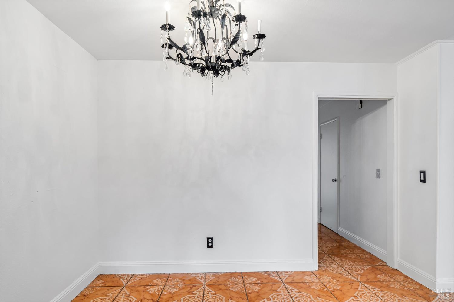 621 Sunny Manor Way Santa Rosa, CA 95401 - Photo 9 of 24 a view of a small space with wooden floor and a chandelier