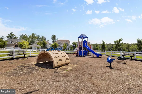a view of outdoor space with slide and entertaining space