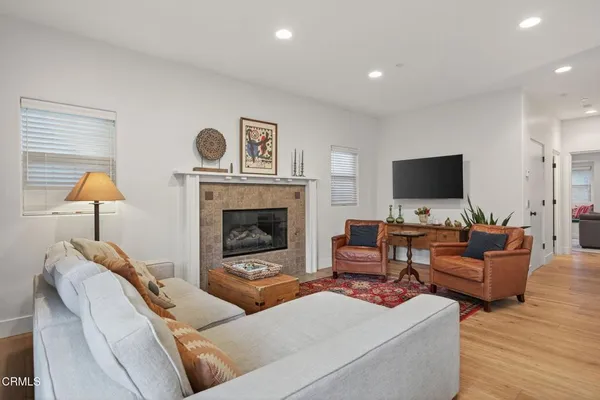 a living room with furniture a window and a fireplace