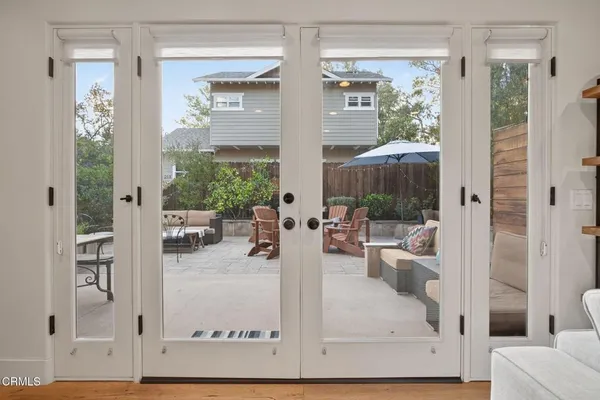 a kitchen with granite countertop a refrigerator and a sink