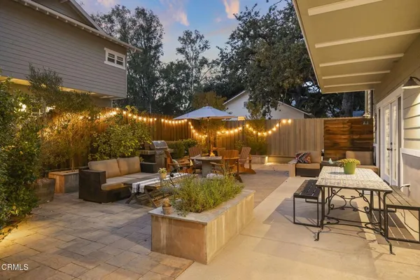 a view of a patio with swimming pool table and chairs