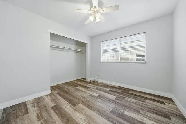 a bedroom with a bed and a table in it