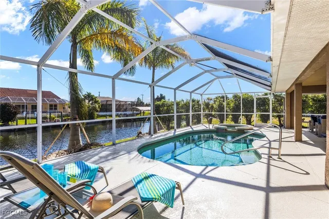 a view of a swimming pool with a lounge chairs