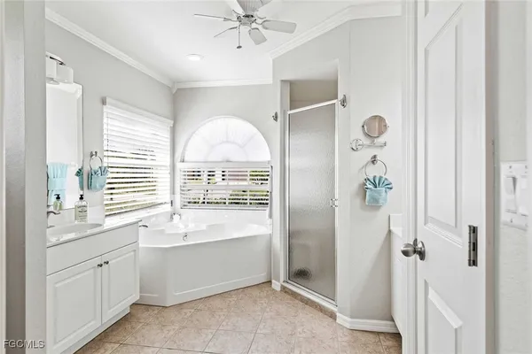 a bathroom with a bathtub sink and mirror