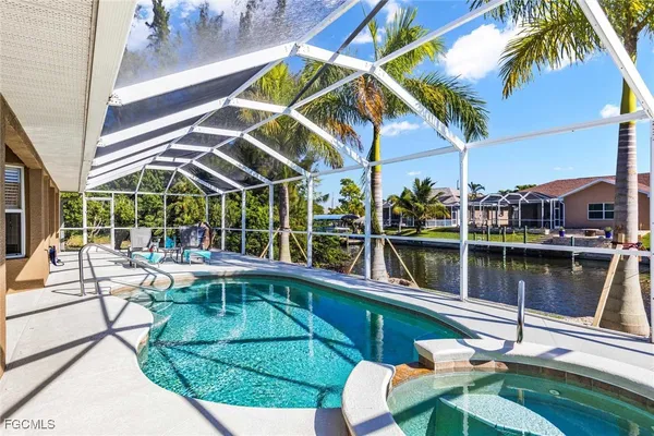 a view of a swimming pool with a patio