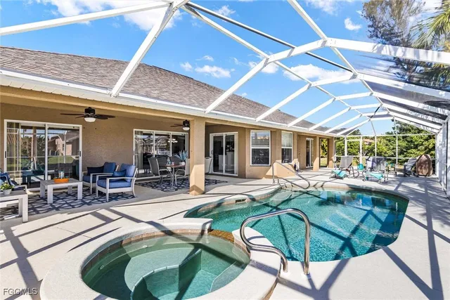 a swimming pool with outdoor seating and yard