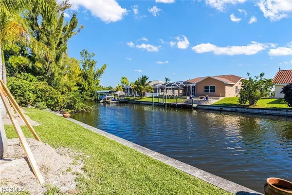 a view of a lake with a house in the background