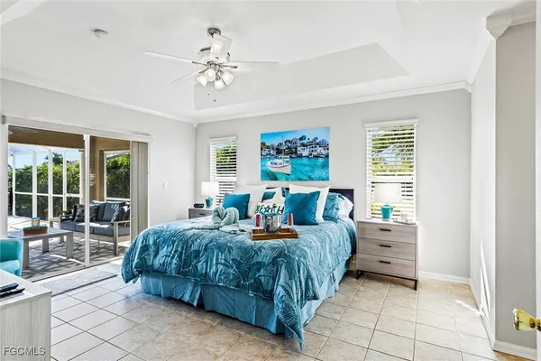 a bedroom with bed and glass door
