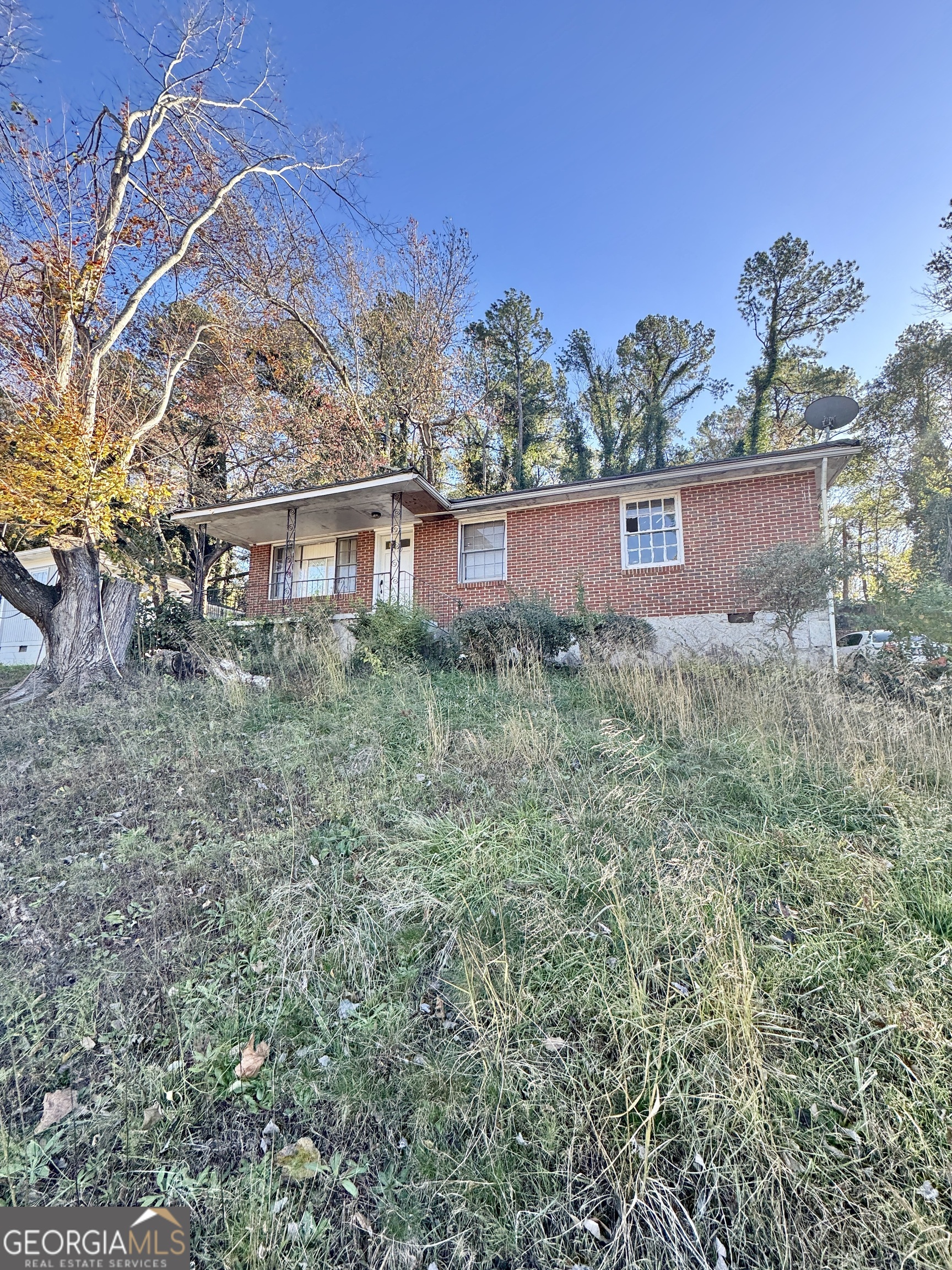 3719 Glenwood Road Decatur, GA 30032 - Photo 1 of 1 a view of a house with a yard and plants