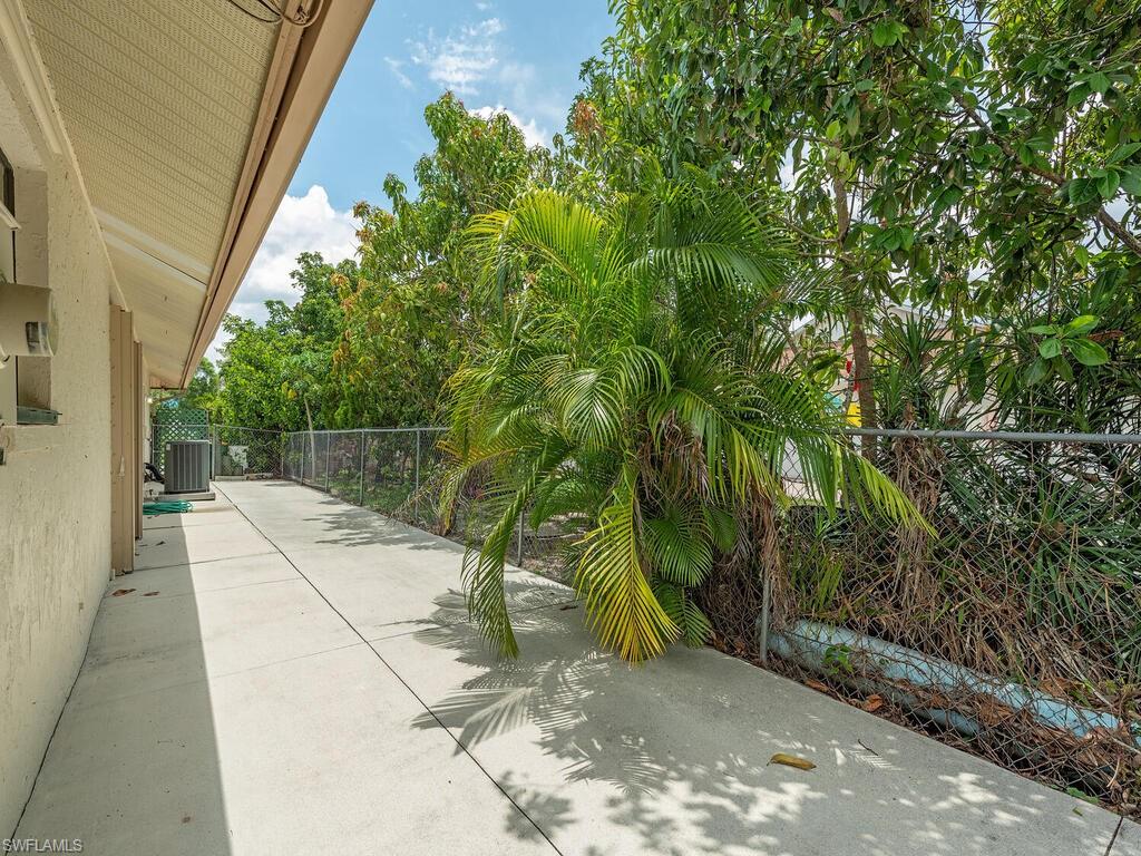 177 6th Street Naples, FL 34113 - Photo 12 of 16 a view of backyard with wooden fence