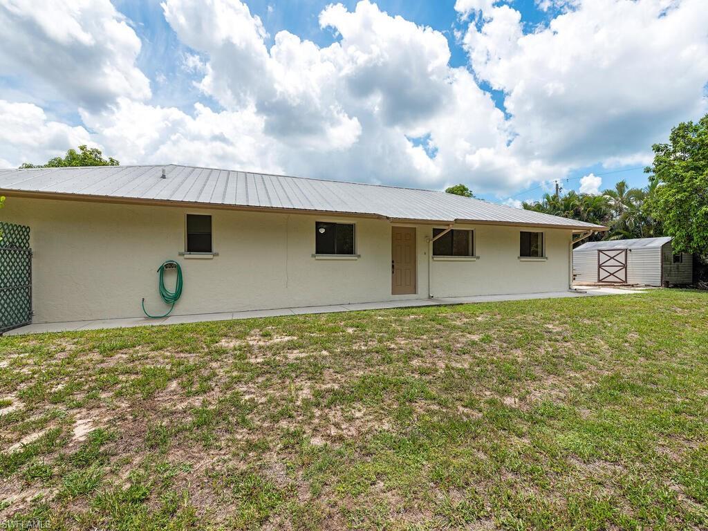 177 6th Street Naples, FL 34113 - Photo 14 of 16 a backyard of a house
