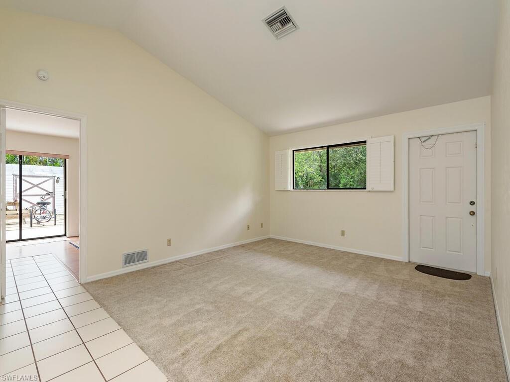 177 6th Street Naples, FL 34113 - Photo 2 of 16 an empty room with windows