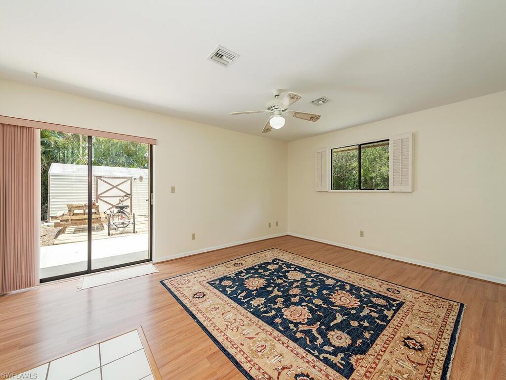 177 6th Street Naples, FL 34113 - Photo 6 of 16 a view of an empty room with a window