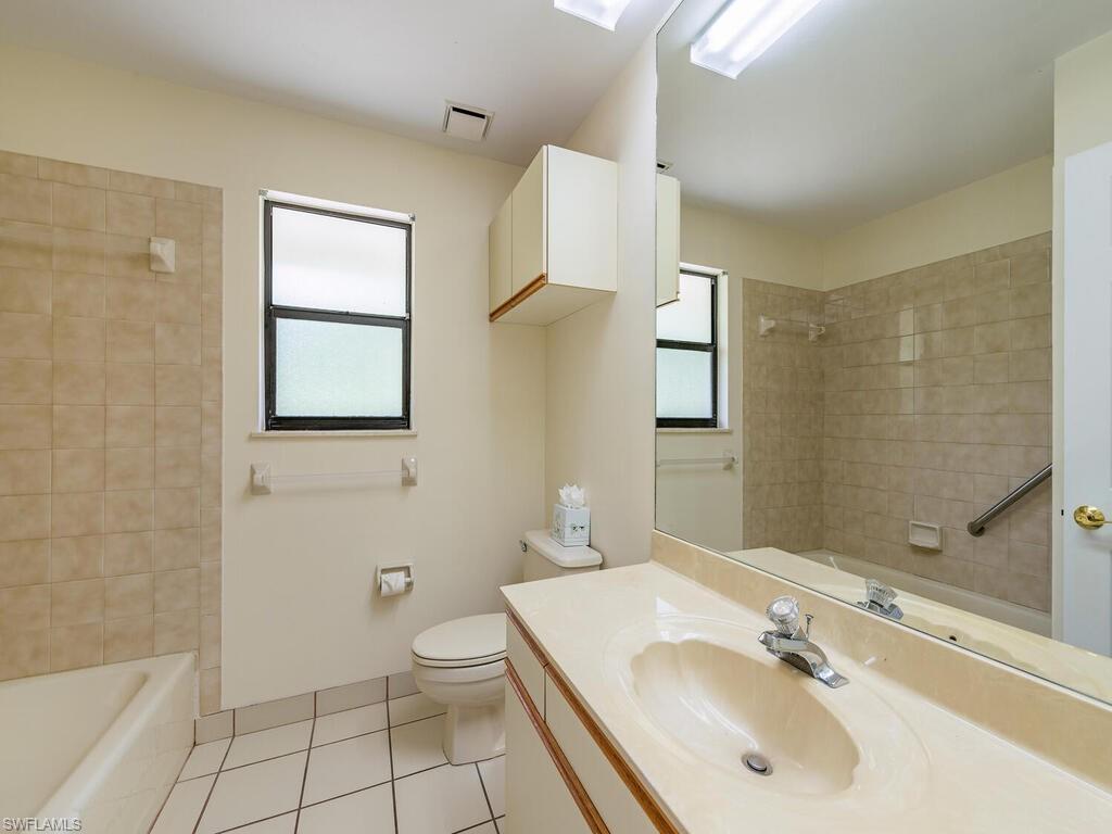 177 6th Street Naples, FL 34113 - Photo 9 of 16 a bathroom with a sink toilet and shower