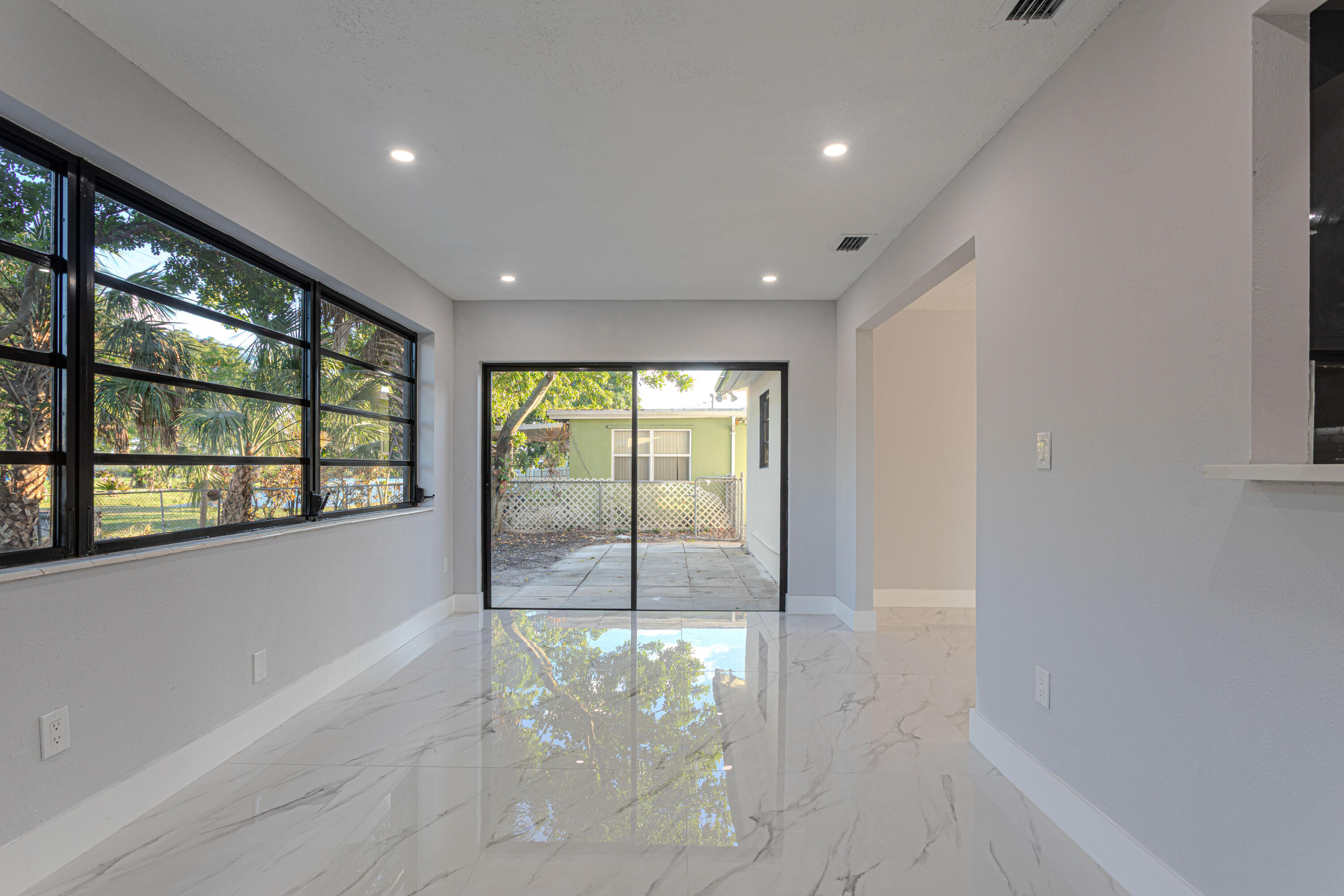 62 Andros Road Palm Springs, FL 33461 - Photo 12 of 41 a very nice looking room with a large window