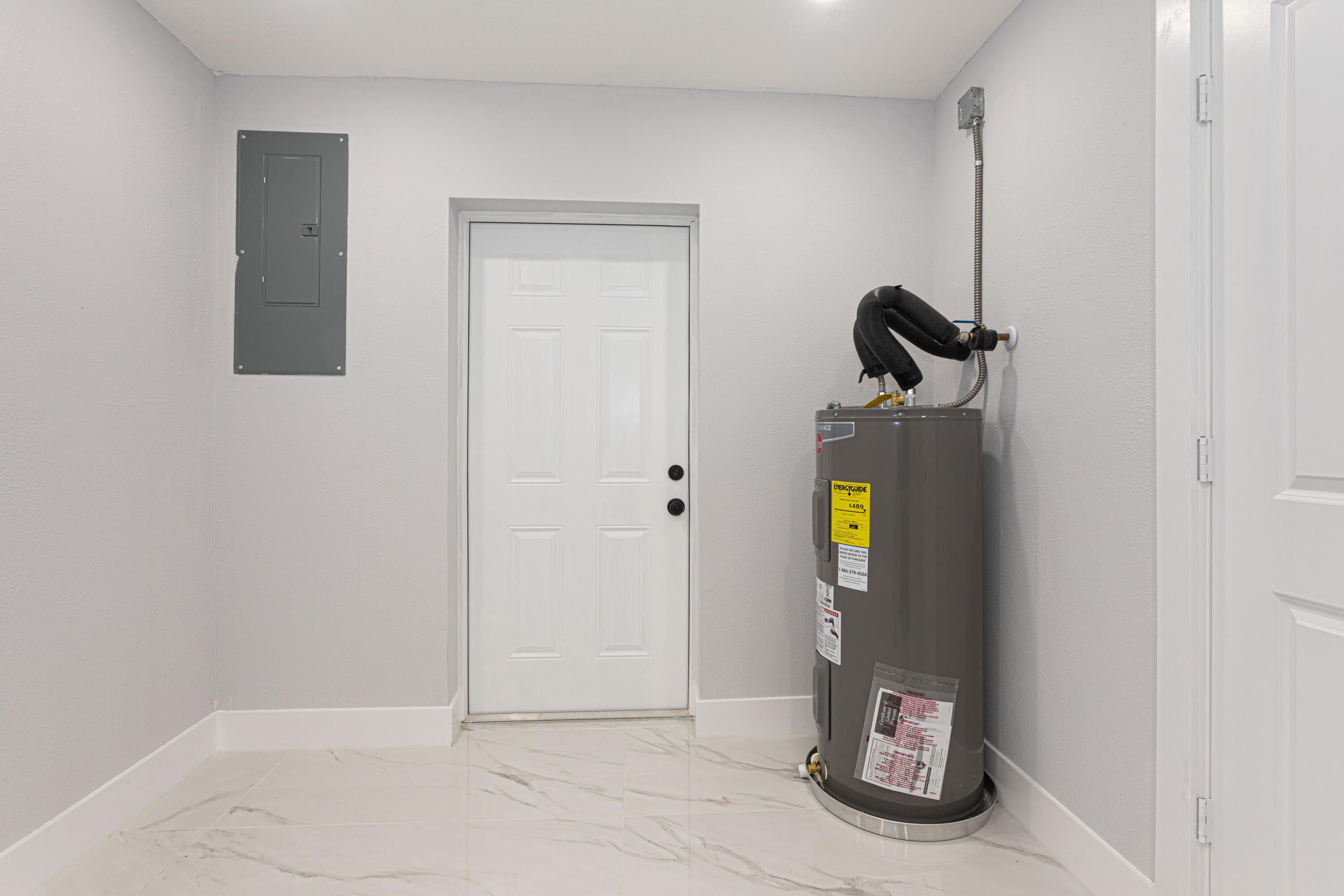 62 Andros Road Palm Springs, FL 33461 - Photo 14 of 41 a view of water heater room