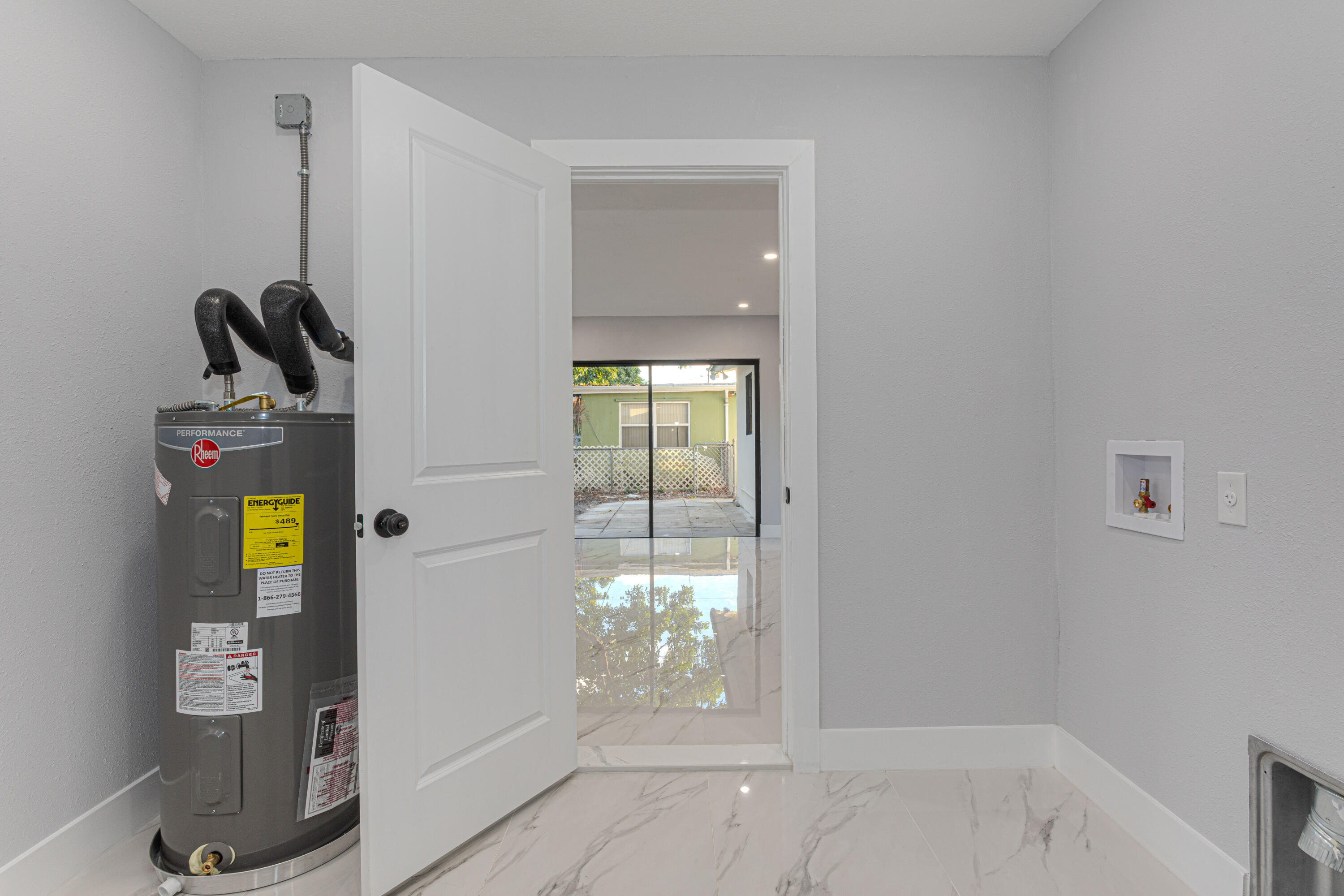 62 Andros Road Palm Springs, FL 33461 - Photo 15 of 41 a bathroom with a window