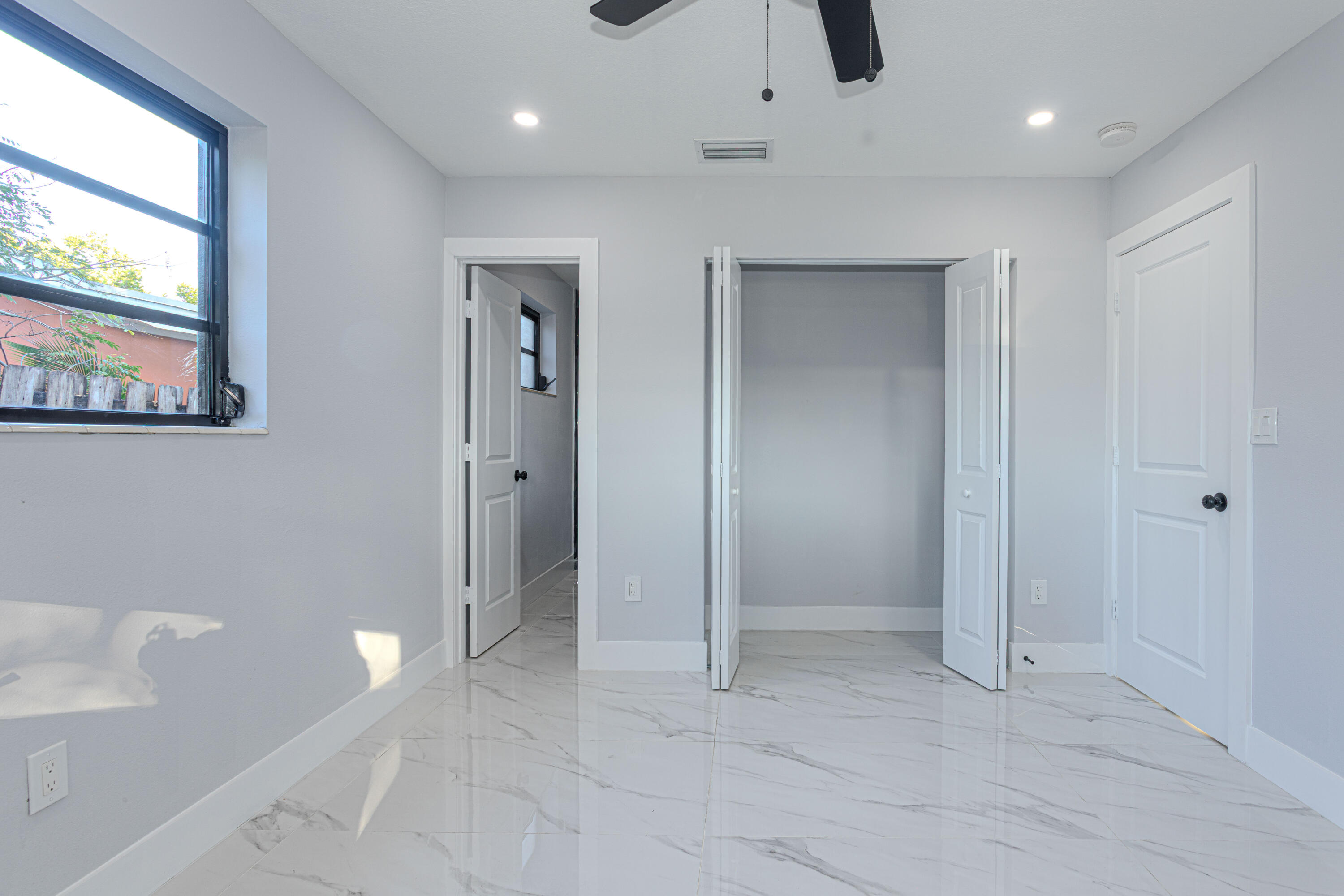 62 Andros Road Palm Springs, FL 33461 - Photo 17 of 41 a view of an empty room with a bathroom