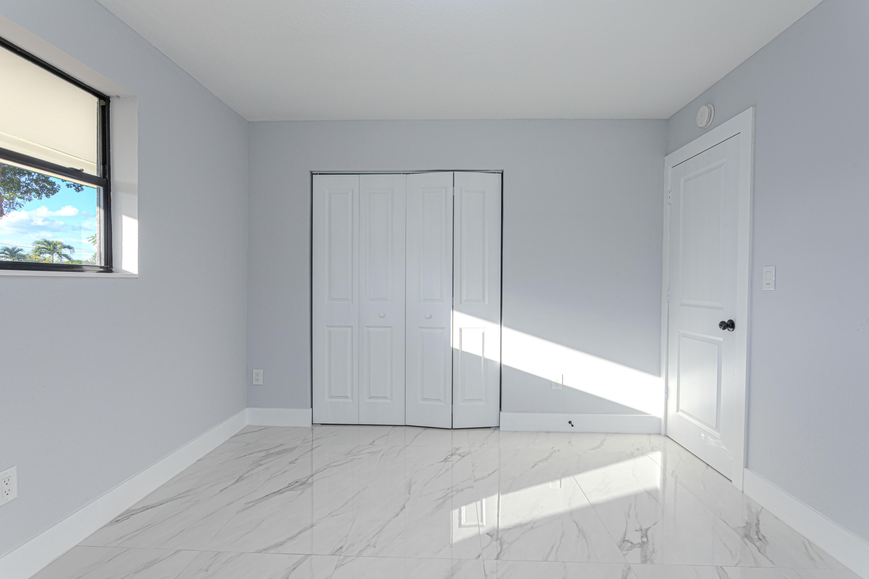 62 Andros Road Palm Springs, FL 33461 - Photo 21 of 41 an empty room with windows