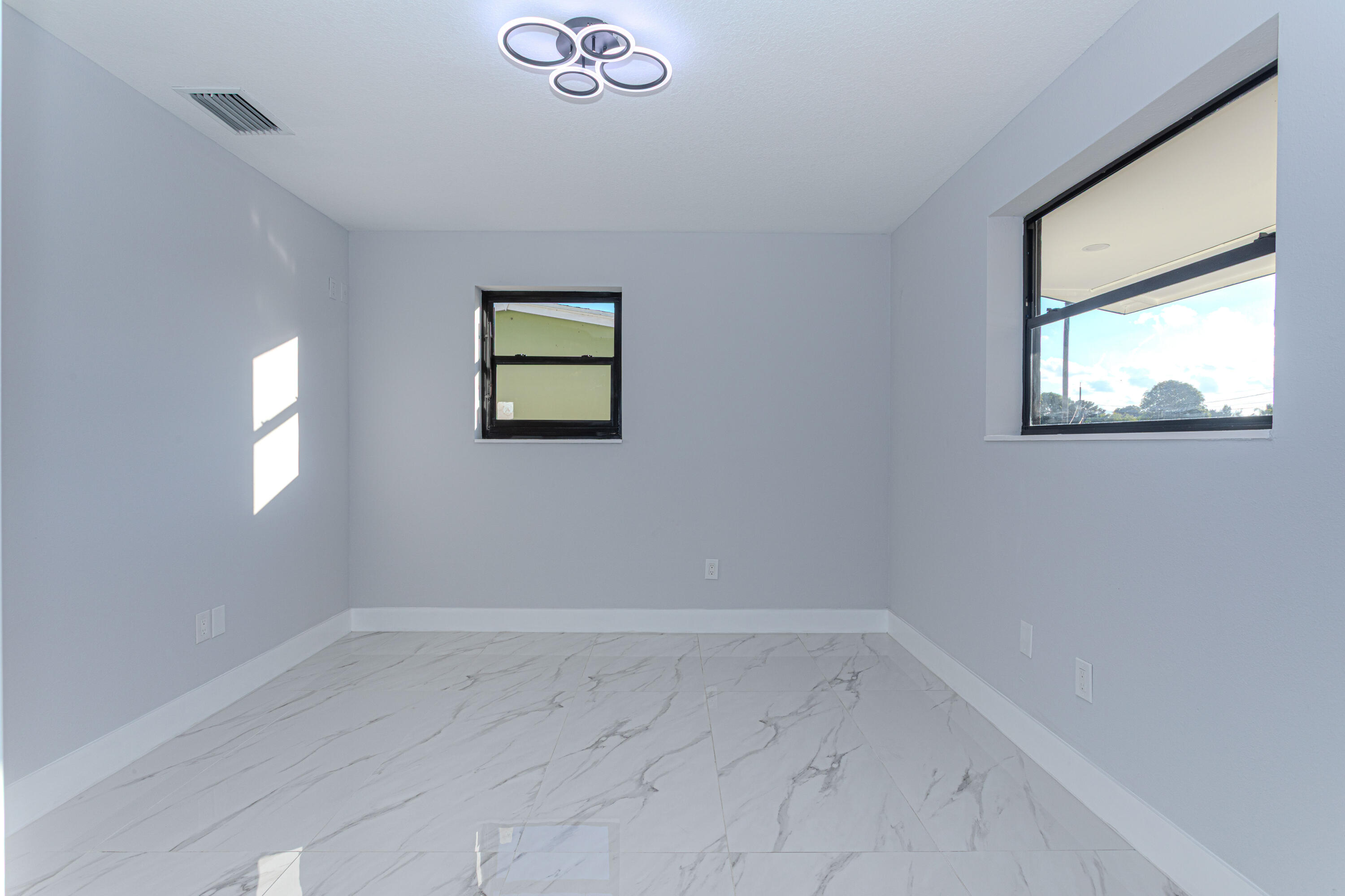 62 Andros Road Palm Springs, FL 33461 - Photo 22 of 41 an empty room with a window