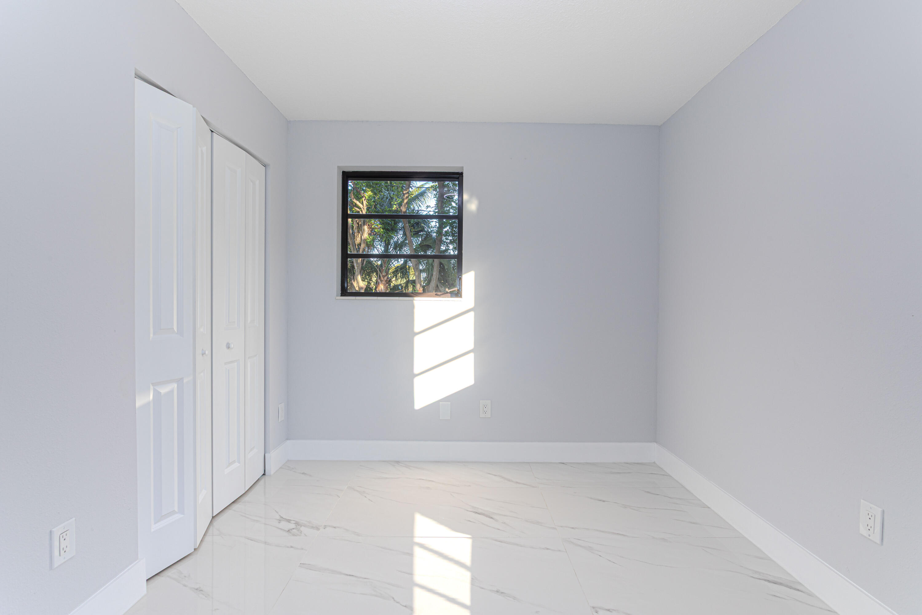 62 Andros Road Palm Springs, FL 33461 - Photo 23 of 41 an empty room with windows