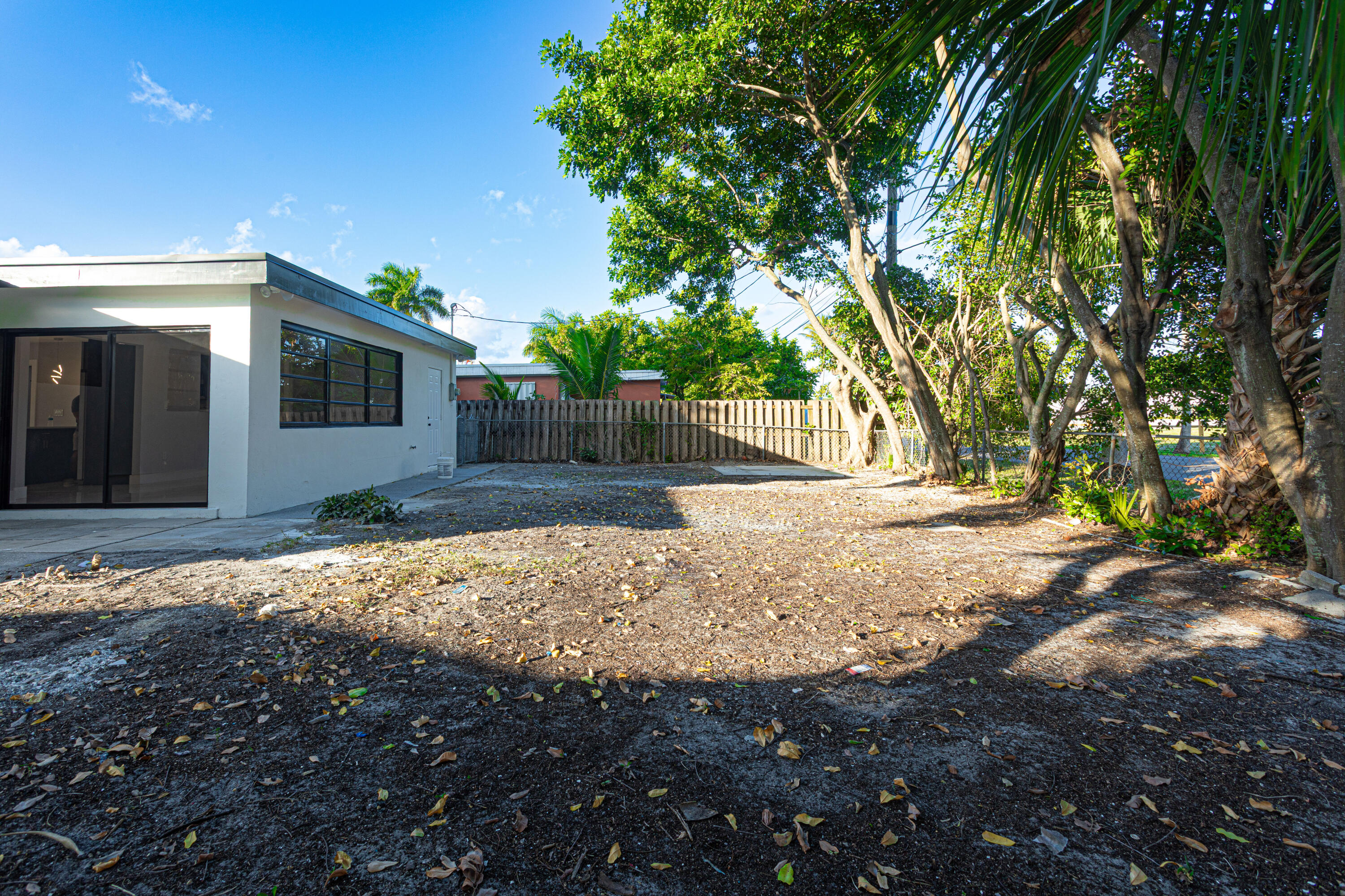 62 Andros Road Palm Springs, FL 33461 - Photo 26 of 41 a view of backyard of house with green space
