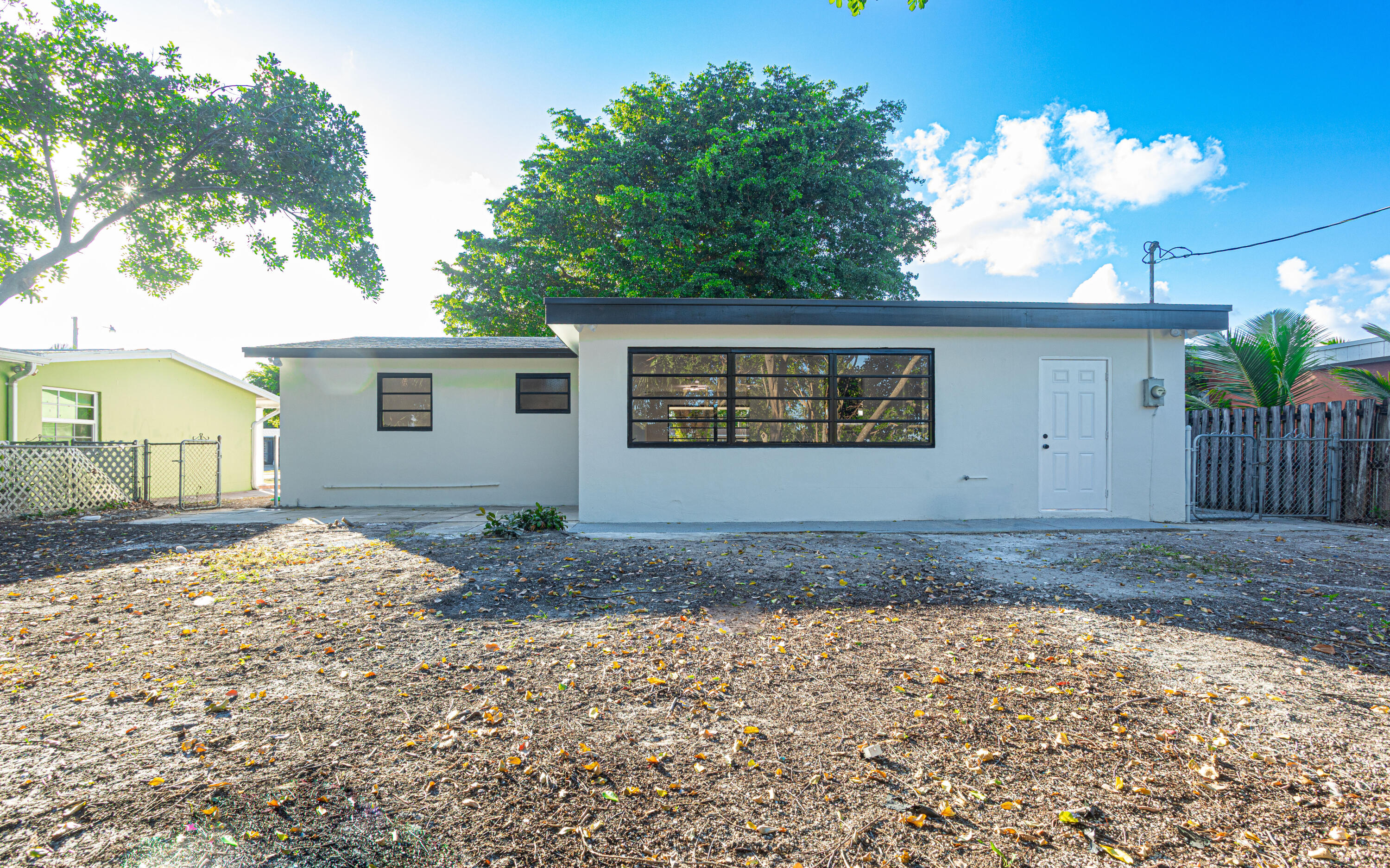 62 Andros Road Palm Springs, FL 33461 - Photo 28 of 41 a view of a house with a yard